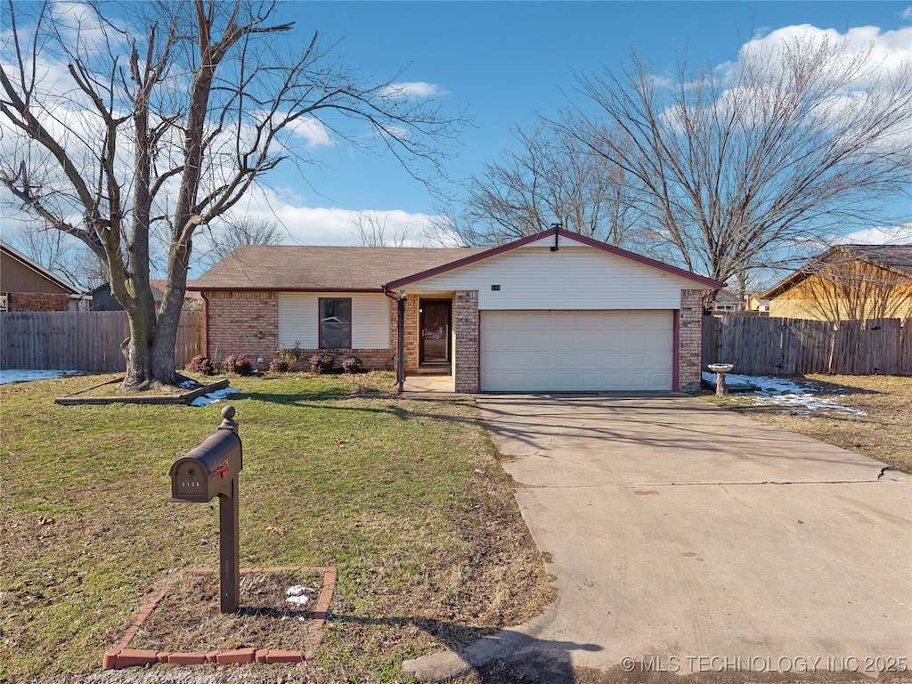 ranch-style house with a front lawn and a garage