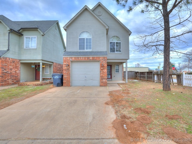 view of front of house with a garage and a front lawn