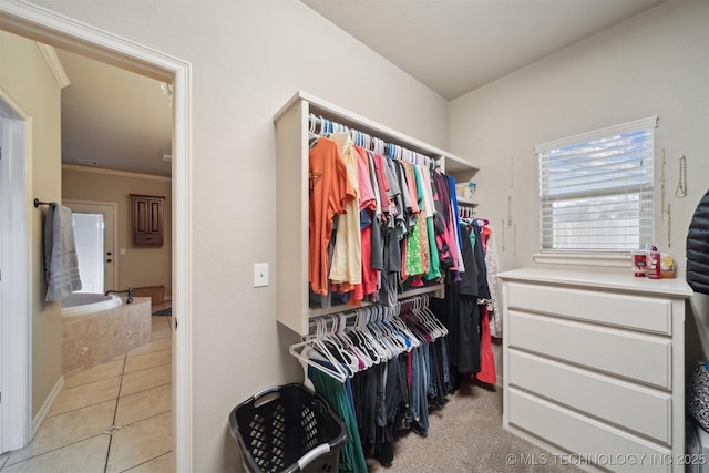 spacious closet with light tile patterned flooring