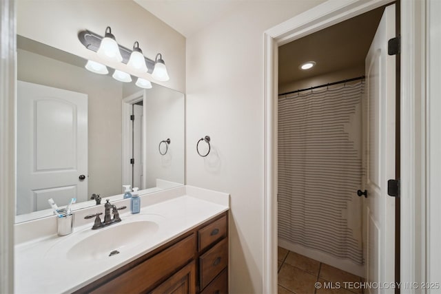 bathroom featuring a shower with curtain, tile patterned flooring, and vanity