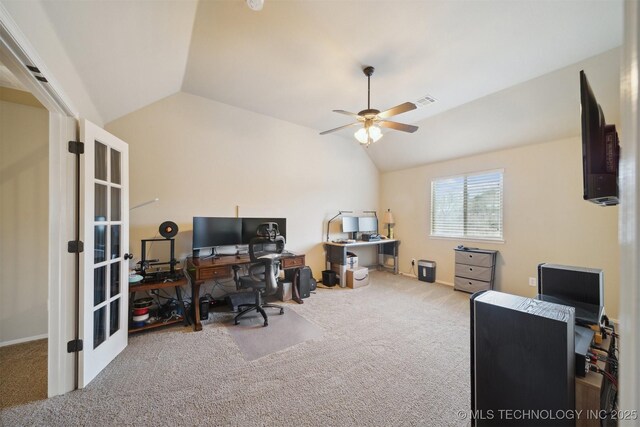 home office featuring lofted ceiling, carpet flooring, and ceiling fan