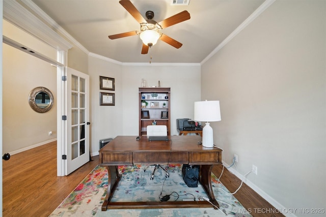 home office with french doors, hardwood / wood-style floors, ornamental molding, and ceiling fan