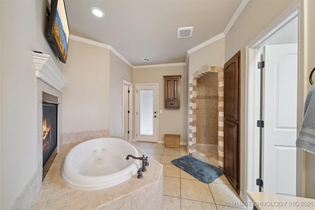 bathroom featuring a fireplace, ornamental molding, tile patterned floors, and independent shower and bath