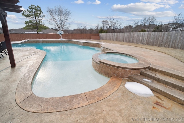 view of pool with an in ground hot tub