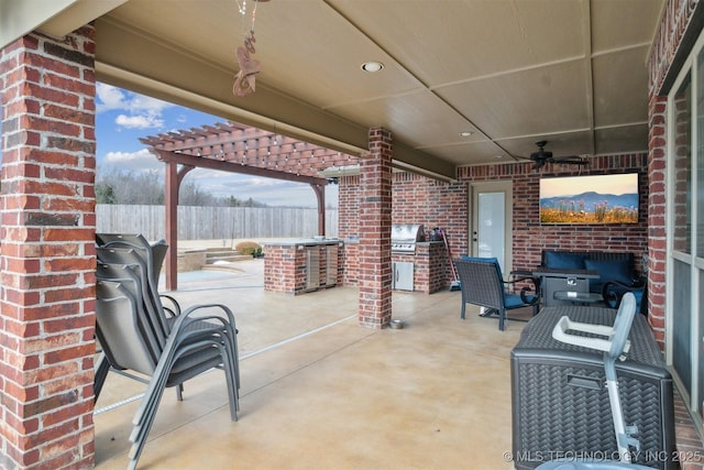 view of patio / terrace with ceiling fan, a pergola, exterior kitchen, and grilling area