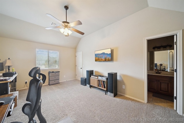 carpeted office featuring ceiling fan, lofted ceiling, and sink