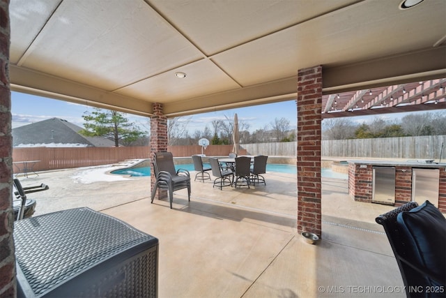 view of patio / terrace featuring a pergola, a fenced in pool, and area for grilling