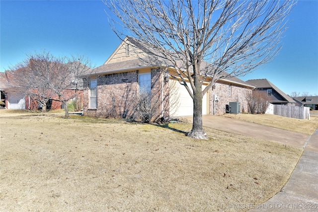 view of home's exterior featuring central AC unit, a lawn, and a garage