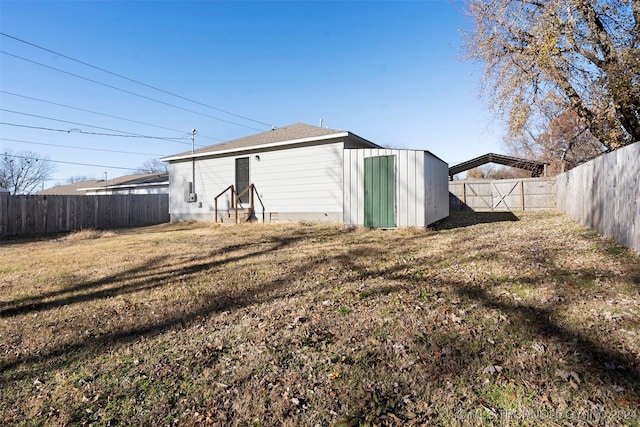 exterior space with a lawn and an outbuilding