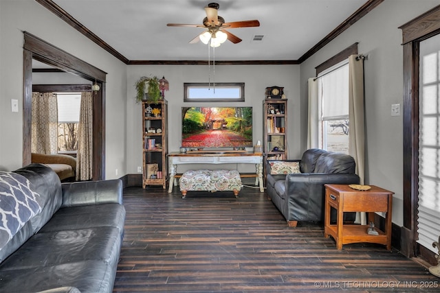 living room with ornamental molding, dark hardwood / wood-style flooring, and plenty of natural light