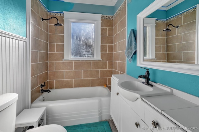 full bathroom with tiled shower / bath combo, vanity, and toilet