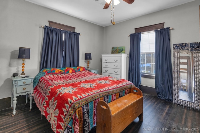 bedroom with ceiling fan and dark wood-type flooring