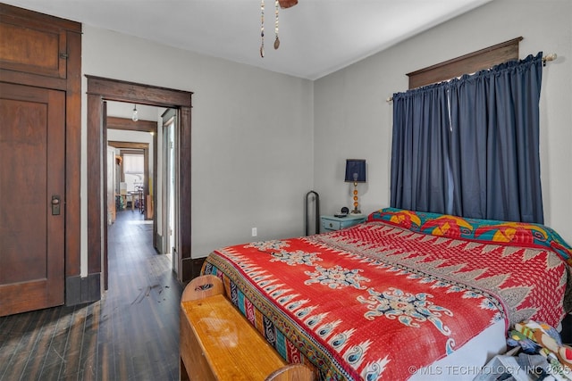 bedroom featuring dark hardwood / wood-style flooring