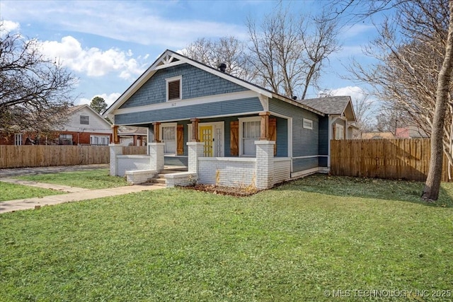 view of front of home featuring a front yard and a porch