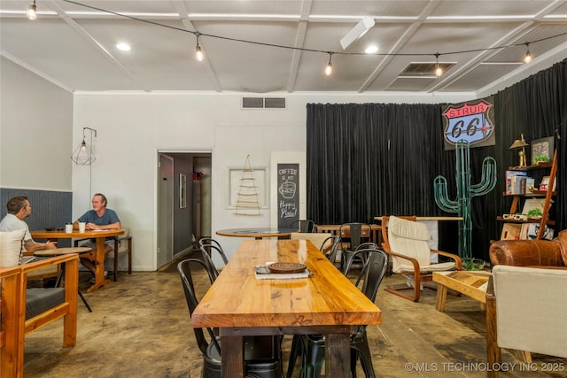 dining space with concrete flooring