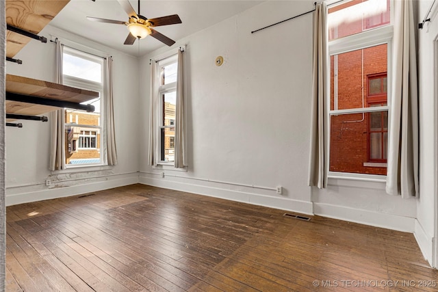 spare room with wood-type flooring and ceiling fan