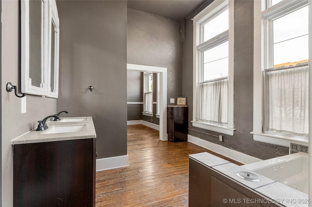 bathroom featuring vanity and hardwood / wood-style flooring