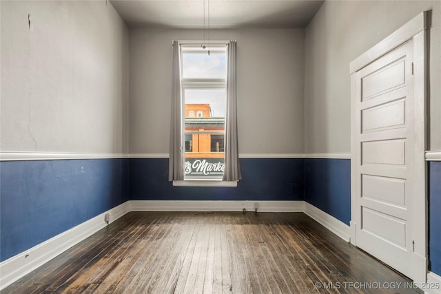 empty room featuring dark hardwood / wood-style floors