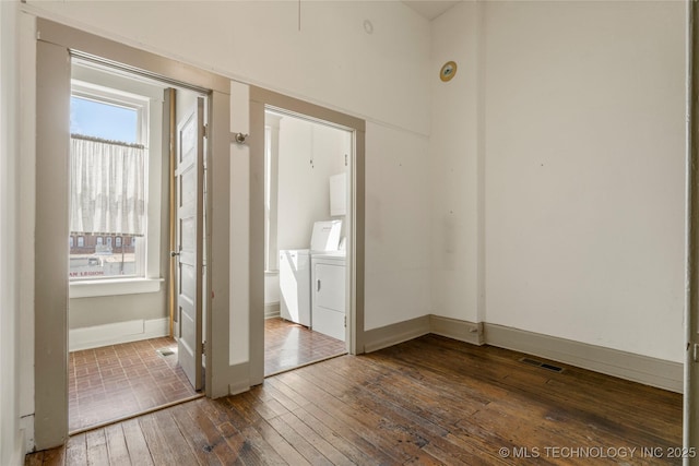 interior space featuring separate washer and dryer and wood-type flooring