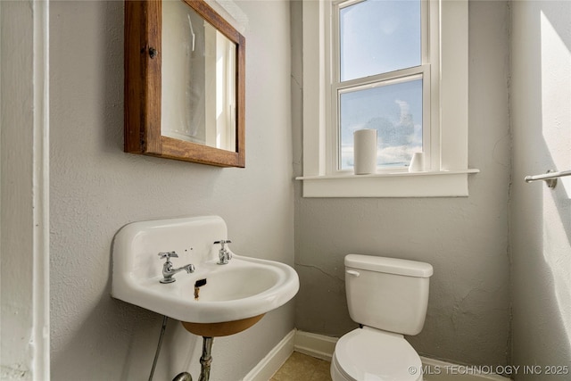 bathroom featuring toilet