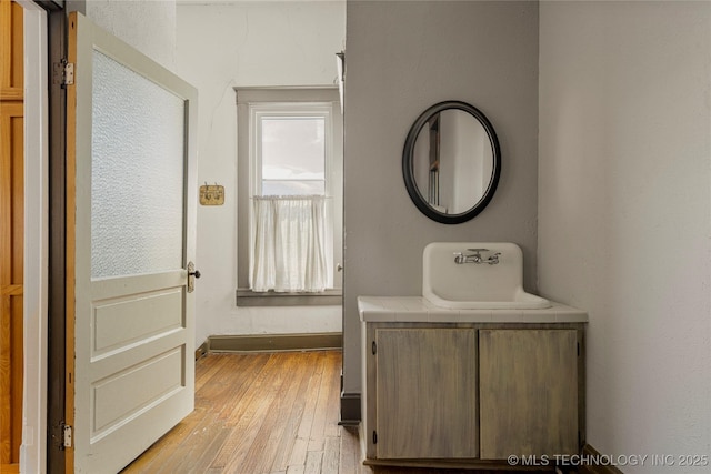 hallway with light hardwood / wood-style flooring