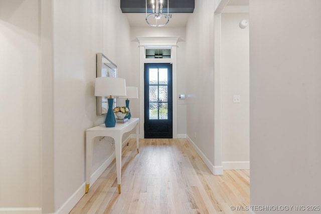 5809 E 126th Pl S, Tulsa, OK 74008 - entryway with wood finished floors, a chandelier, and baseboards