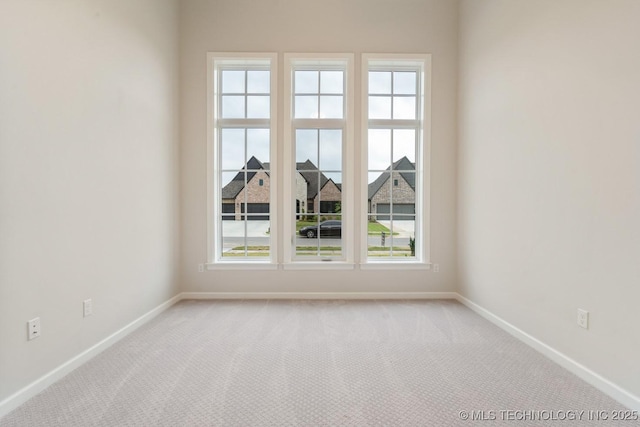 5809 E 126th Pl S, Tulsa, OK 74008 - empty room with baseboards and healthy amount of natural light