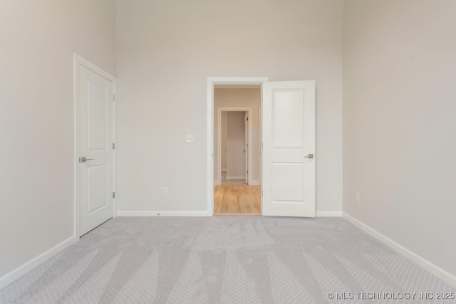 5809 E 126th Pl S, Tulsa, OK 74008 - unfurnished bedroom with light carpet and baseboards