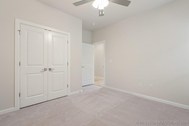 5809 E 126th Pl S, Tulsa, OK 74008 - unfurnished bedroom featuring light carpet, baseboards, a closet, and ceiling fan