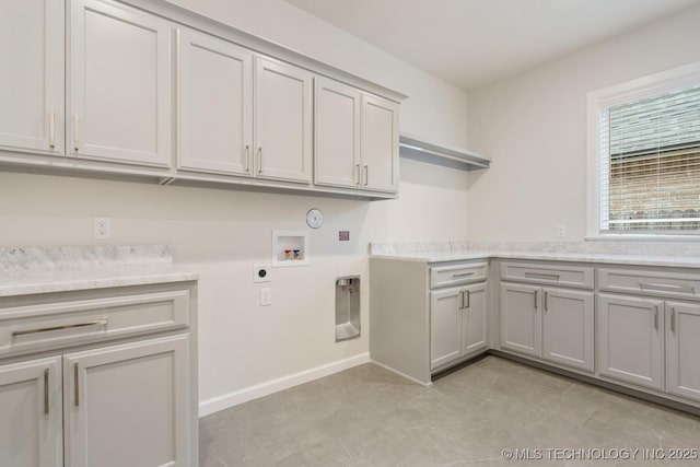 5809 E 126th Pl S, Tulsa, OK 74008 - laundry room with cabinet space, hookup for an electric dryer, washer hookup, gas dryer hookup, and baseboards