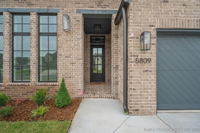 5809 E 126th Pl S, Tulsa, OK 74008 - entrance to property featuring brick siding and a garage