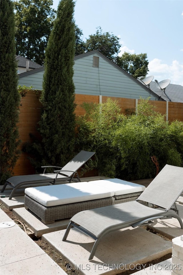 view of side of home with a patio