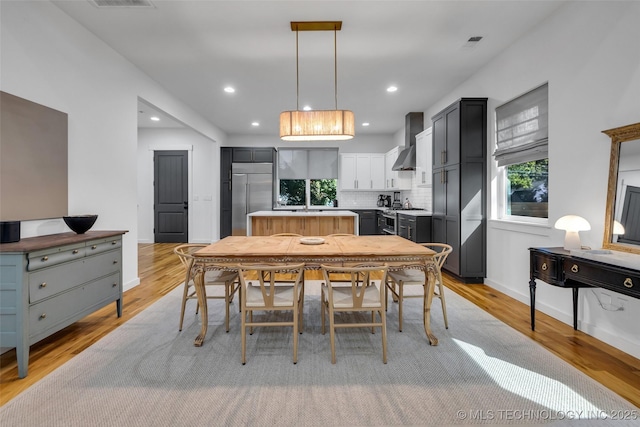 dining room featuring light wood-type flooring