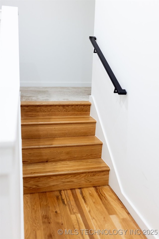 stairway with wood-type flooring