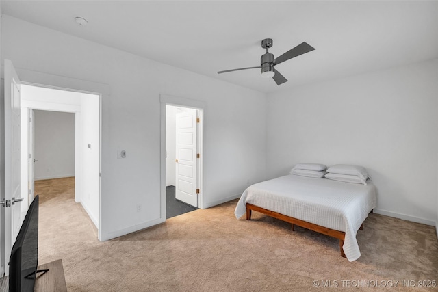 bedroom with ceiling fan and carpet flooring