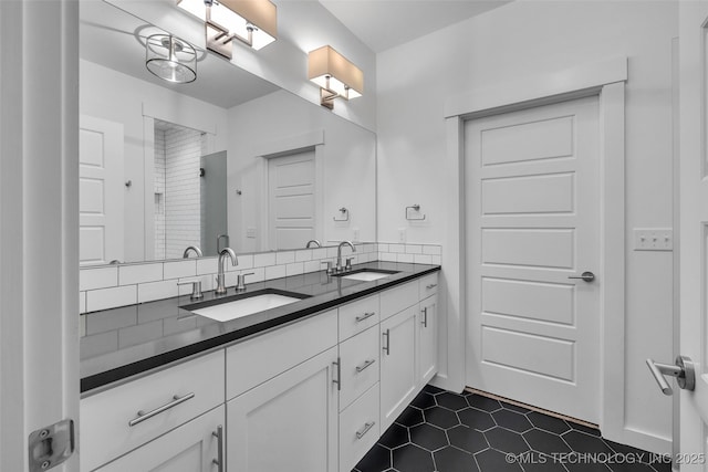 bathroom with backsplash and vanity