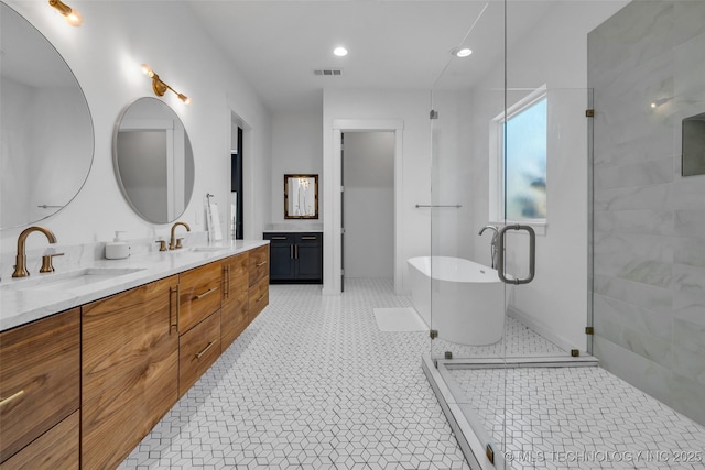 bathroom with tile patterned flooring, shower with separate bathtub, and vanity