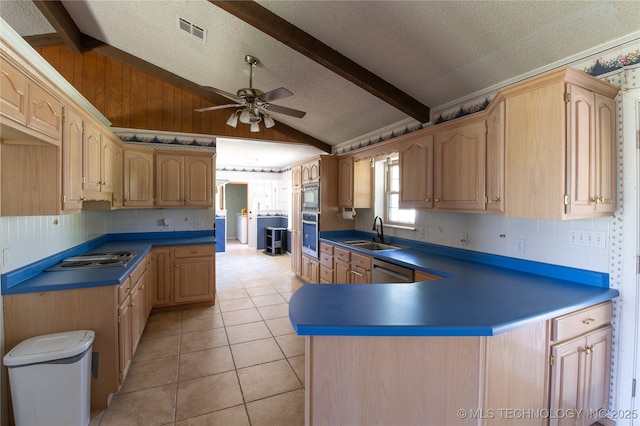 kitchen with light brown cabinetry, sink, lofted ceiling with beams, light tile patterned floors, and stainless steel appliances