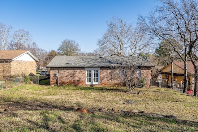 back of property featuring a lawn