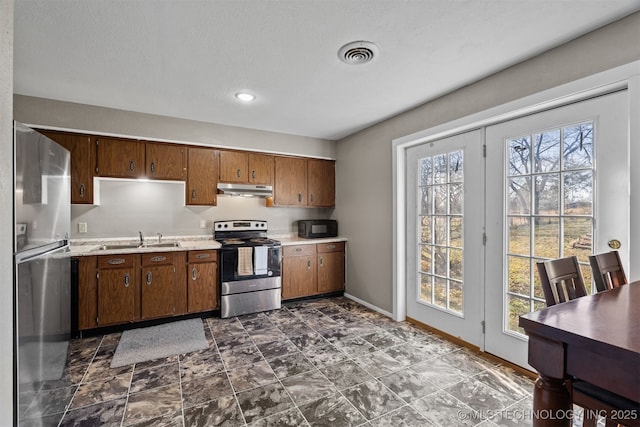 kitchen featuring stainless steel appliances and sink