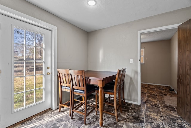 dining room with a textured ceiling