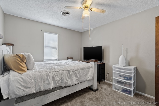 carpeted bedroom with a textured ceiling and ceiling fan