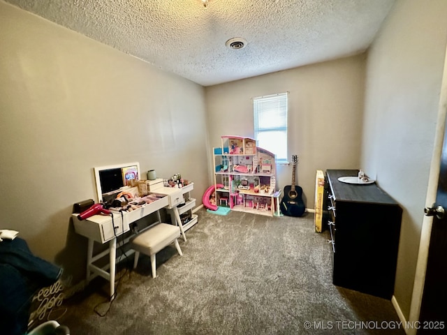 interior space featuring carpet flooring and a textured ceiling