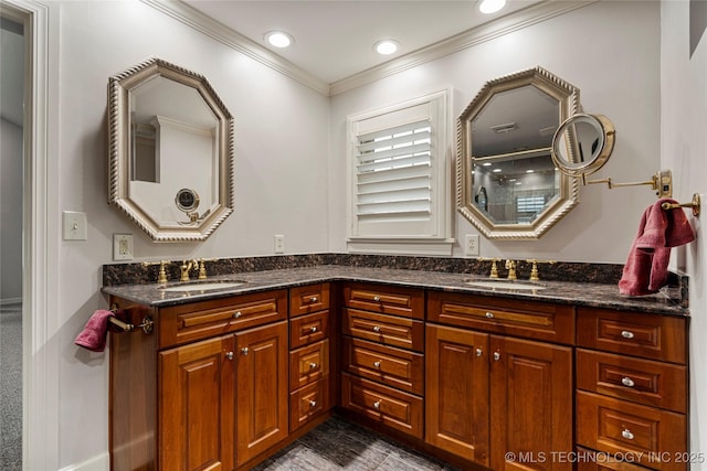 bathroom featuring crown molding and vanity