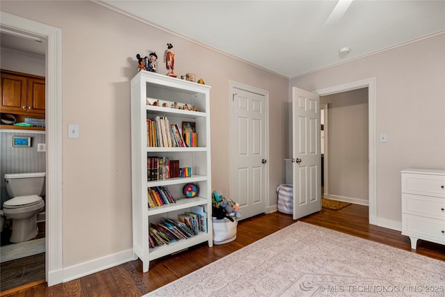 bedroom featuring ensuite bathroom, ceiling fan, and wood-type flooring