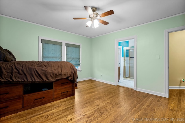 bedroom featuring ceiling fan, light hardwood / wood-style flooring, connected bathroom, and ornamental molding