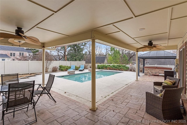 view of swimming pool with a patio and a gazebo