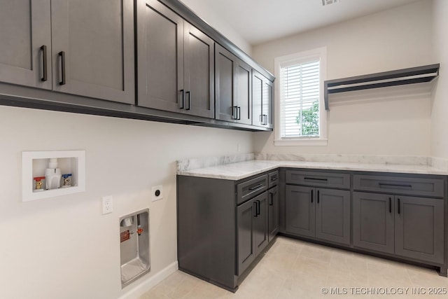 223 W 172nd St S, Mounds, OK 74047 - laundry room with cabinet space, washer hookup, hookup for an electric dryer, and light tile patterned flooring