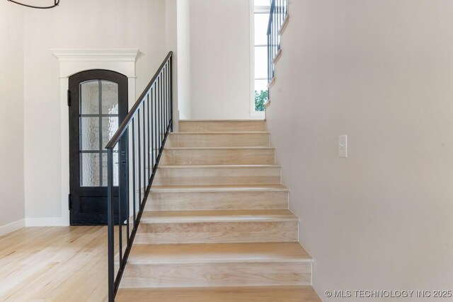 223 W 172nd St S, Mounds, OK 74047 - stairway with wood finished floors and arched walkways