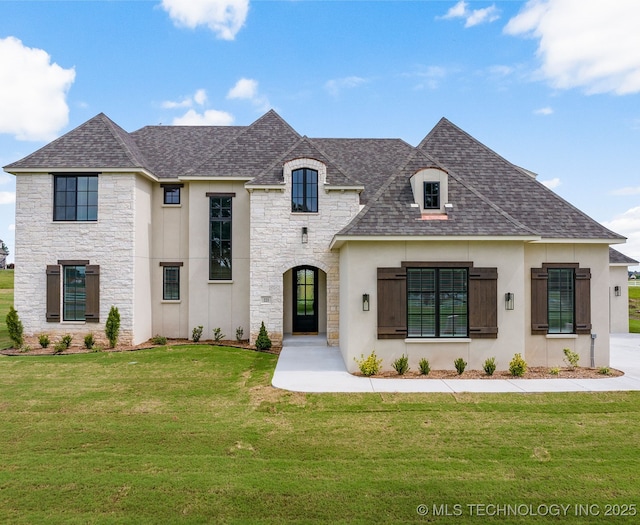 223 W 172nd St S, Mounds, OK 74047 - french country inspired facade with stone siding, a shingled roof, and a front yard